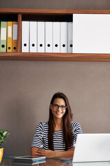 Laptop, portrait and business woman in administration for planning, editing and email in workplace....