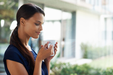 Woman, thinking and drinking coffee in home to relax, peace or calm at breakfast for energy in the...