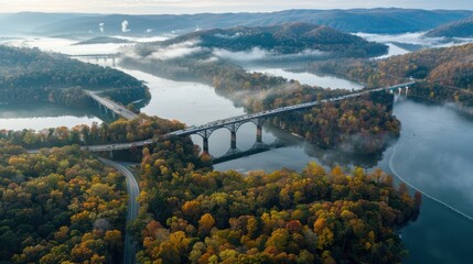Fototapeta premium Aerial view of a large bridge crossing a beautiful forest. 