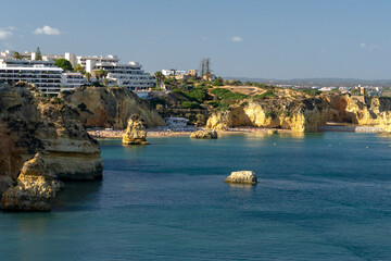 Praia de dona Ana, Ponta da Piedade, panoramic view of famous rock formations with arches at...