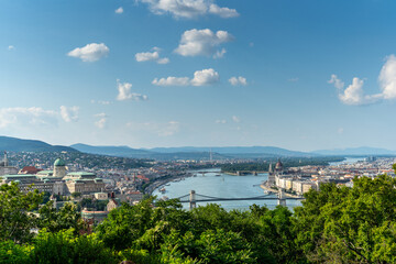 Fototapeta na wymiar City ​​of Budapest. Urban landscape panorama with chain bridge over the Danube, old buildings and opera domes. Hungary