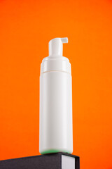 Beauty spa medical skincare and cosmetic lotion bottle cream packaging product on orange background