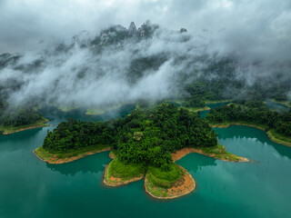 Aerial drone view of island on the lake, tropical Mountain peak , Khao Sok National Park, Thailand - 748632916