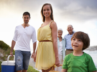 Portrait, picnic and family on beach for vacation, adventure and tropical holiday in Australia. Grandparents, parents and happy face of boy child at ocean with sunshine, weekend and smile in summer.