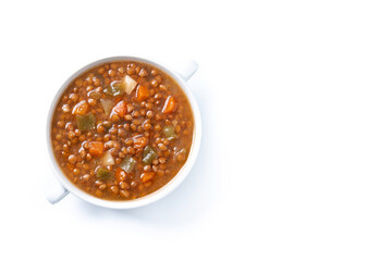 Lentil soup with vegetables in bowl isolated on white background. Top view. Copy space