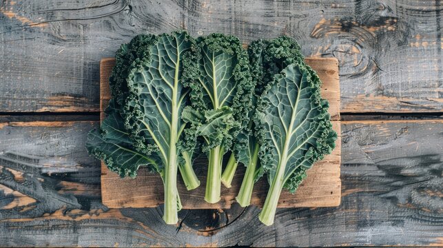 Kale cabbage green leaves on a wooden board,Leaves of fresh vegetables, organic vegetables for health