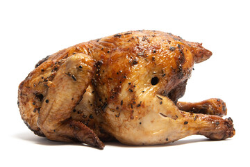 A whole delicious roasted chicken seasoned with herbs isolated on white background clipping path