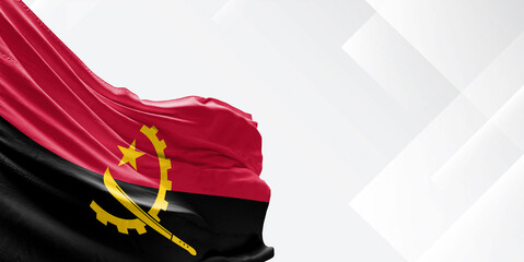 Angola national flag cloth fabric waving on beautiful white Background.