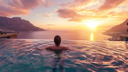 Photo sur Plexiglas Coucher de soleil sur la plage  travel woman swimming in pool  with beautiful sunset 