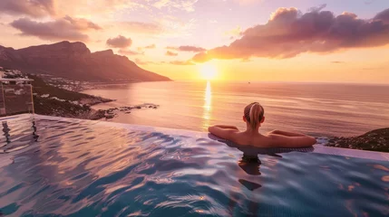 Crédence de cuisine en verre imprimé Coucher de soleil sur la plage  travel woman swimming in pool  with beautiful sunset 