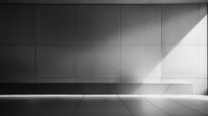 Minimalist interior space with a dramatic play of light and shadow, ideal for backgrounds.