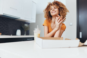 CurlyHaired Woman Enjoying Pizza at Kitchen Table in Cozy Home Setting