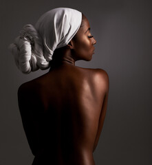 Beauty, body and heritage with natural black woman in studio on gray background for wellness....