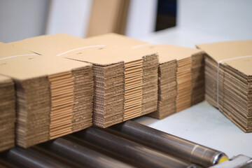 A pile of freshly made unprepared brown card board boxes fresh from manufacture. Cardboard box...