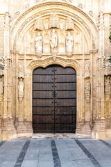 One of the large wooden entrance doors with ornaments of the of Mosque–Cathedral of Cordoba or Cathedral of Our Lady of the Assumption or Mezquita in Cordoba, Spain