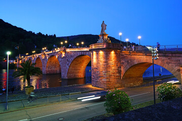 Fototapeta na wymiar The old bridge Alte Brucke across the river Neckar in the old german city Heidelberg. Monkey bridge.