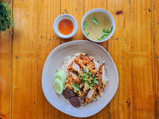 Deep fried chicken plate with sauce in serve with rice, soup
