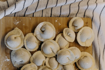 homemade dumplings with filling. cooking hobby.preparation of semi-finished products.dough ravioli.National cuisine.aesthetic appearance.
meat in dough.
Yummy.
promotion and advertising.
tasty food.