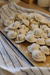 Fototapeta na wymiar homemade dumplings with filling. cooking hobby.preparation of semi-finished products.dough ravioli.National cuisine.aesthetic appearance. meat in dough. Yummy. promotion and advertising. tasty food.