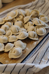 homemade dumplings with filling. cooking hobby.preparation of semi-finished products.dough ravioli.National cuisine.aesthetic appearance.
meat in dough.
Yummy.
promotion and advertising.
tasty food.