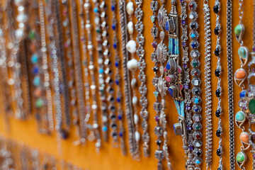 Necklaces and bracelets with precious stones in beautiful colors in Nizwa Souq