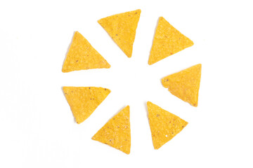 Crispy corn tortilla nachos chips photo concept of circle formation isolated on white background...