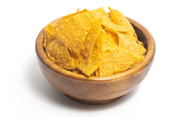 Crispy corn tortilla nachos chips in a wooden bowl isolated on white background clipping path