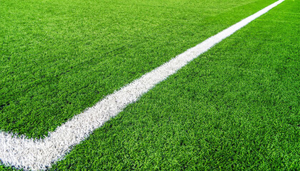 Line on Soccer field or football field texture background. White lines on green grass, symbol to the way to success. Sport and business background concept.