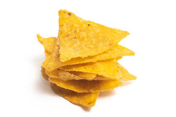 Stacked of crispy corn tortilla nachos chips isolated on white background clipping path