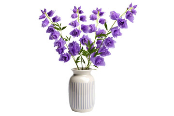 A white vase filled with vibrant purple flowers sitting on a table. The delicate petals contrast beautifully against the clean white of the vase, creating a striking visual display.