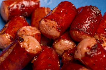 pieces of fried sausage on a plate.