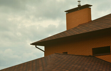 The house is equipped with high-quality roofing of shingles (bitumen tiles). A good example of perfect roofing. The roof is reliably protected from adverse weather conditions.