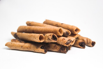 rolled wafer sticks, on a white background