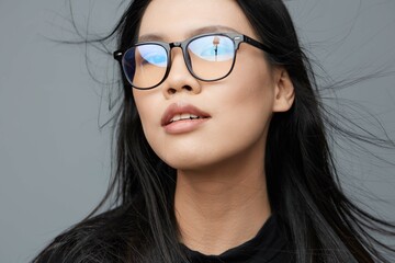 Woman cute portrait beautiful background glasses studio student smile face attractive fashion asian business beauty