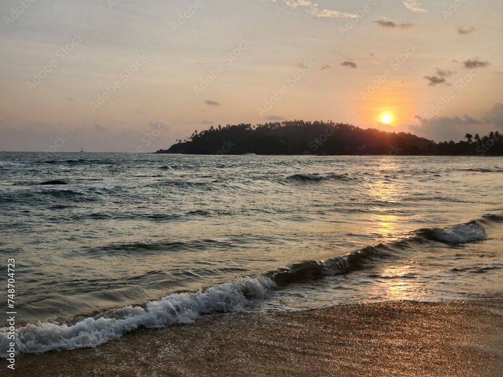 Wall mural Beautiful sunset by the beach of Mirissa, Sri Lanka