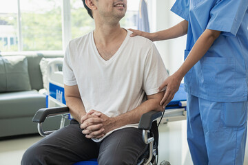 An Asian male patient lies in a hospital bed and receives good care from a doctor. Doctor giving advice to male patient working on health diagnosis