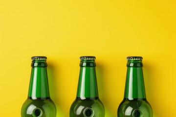 Three green bottle necks on a yellow background