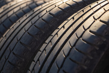 shot of a set of summer, fuel efficient car tires, Contrasty lighting and shallow depth of field