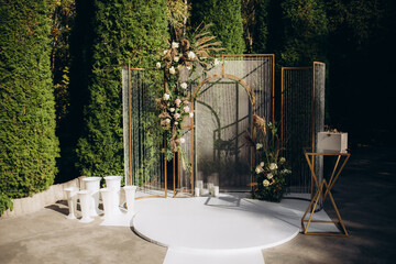 circle wedding arch with flower petals and candles