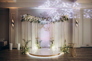 Beautiful modern hexagon wedding arch for unique contemporary wedding ceremony with fresh greenery...