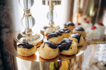 A delicious wedding. Candy bar for a banquet. Celebration concept. Fashionable desserts. Table with sweets, candies. Fruits