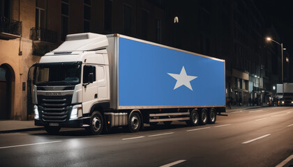 A truck with the national flag of Somalia depicted carries goods to another country along the highway. Concept of export-import,transportation, national delivery of goods.
