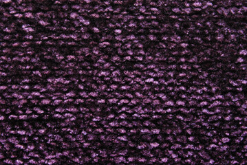 Purple fluffy velvet knit fabric pattern as background
