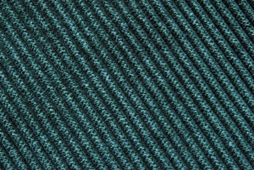 Dark green corduroy fabric texture as background