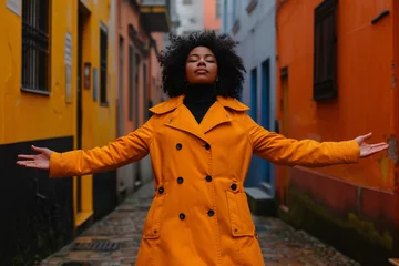 Papier Peint photo autocollant Ruelle étroite satisfied woman Urban Lifestyle: woman in Orange Coat Walking in Colorful Narrow Street