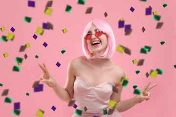 Obraz premium Happy woman and flying confetti on pink background
