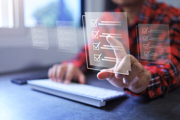 Man tick correct check mark on approve or answer questionnaire on digital document