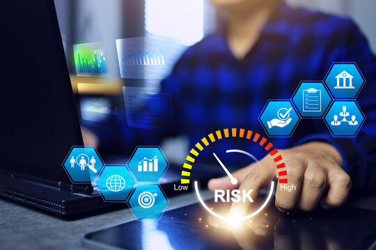 Risk management concept with businessman working on laptop and tablet and plan to reduce investment risk and manage organizational matters such as finance, staff turnover, sales or legal matters