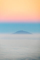 Mt. Meru’s Majestic Sunrise Above the Clouds