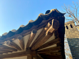 Blue autumn sky and roof corners with roof tiles. It is an architectural style of the Joseon...